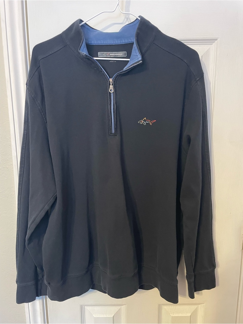 Greg Norman Collection Men's Black Quarter-Zip with Blue Trim and Shark Logo